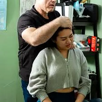 Seated neck assessment at Manhattan Chiropractic Health Services